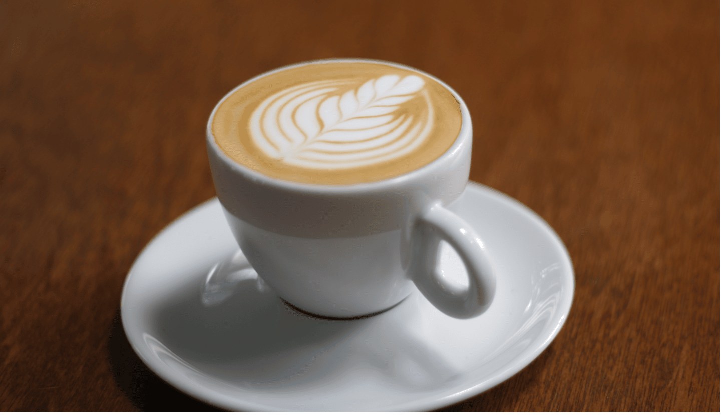 hot latte cup with a leaf design